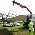 Fassi F90A loader crane used to recover a light airplane