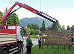 A Fassi crane to place Moroni's sign in Albino